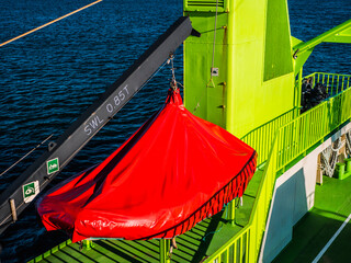 Troia, Setubal, Portugal - March 8, 2020 - Ferry boat crossing Sado River. Sunny day on a green sea...