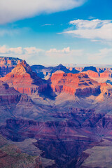 Panoramic image of the colorful Sunset on the Grand Canyon in Grand Canyon National Park from the south rim part,Arizona,USA, on a sunny cloudy day with blue or gloden sky