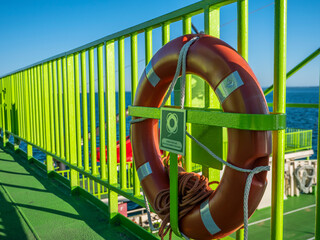Troia, Setubal, Portugal - March 8, 2020 - Ferry boat crossing Sado River. Sunny day on a green sea...