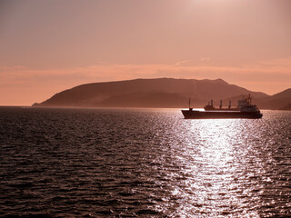 Obraz premium Cargo Transportation Ship leaving Sea Harbor Port