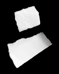 Ripped paper on black background, space for advertising copy.
