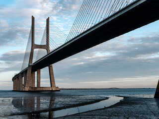 Vasco da Gama Bridge, Lisbon, Portugal. White cloudy sky