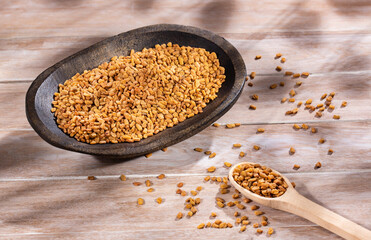 Organic fenugreek seeds in the bowl. Trigonella foenum-graecum