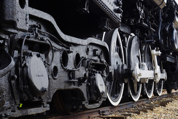 Up close details of the drive wheels of a steam locomotive