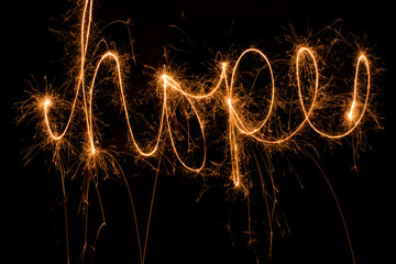 Photos of drawings with sparklers on July 4th