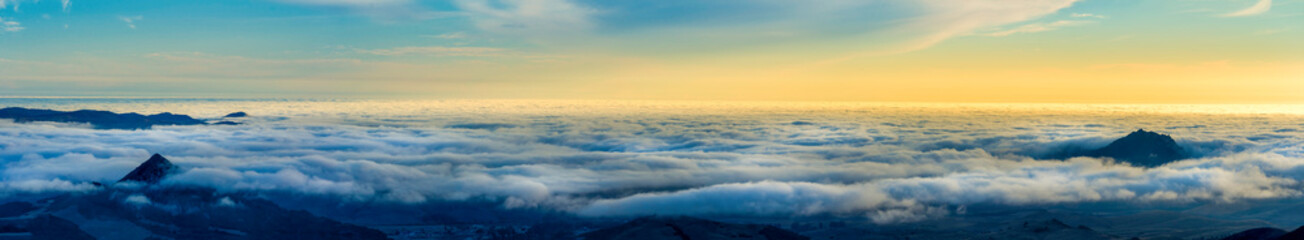 Fototapeta na wymiar Panorama of Valley Filled with Clouds, Sunset, Peak