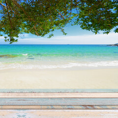 Fototapeta na wymiar Wood table top with nature scene tropical beach