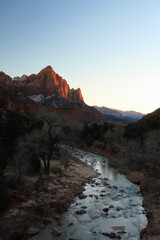 sunset over Zion valley with glassy reflection river