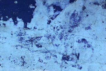 Rough grunge texture of old painted blue wall with stains