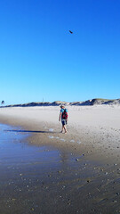 man walking on the beach