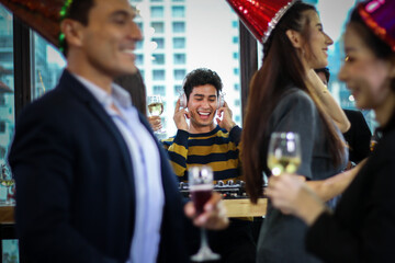 Business people or team or friend or colleagues are drinking together with glass of champagne or alcohol in party after work, happy new year celebration fun in office