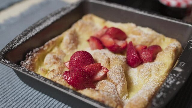 A Panakuken with Strawberries and Powdered Sugar