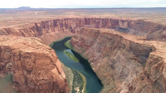 American Wild Wild West wilderness. Cinematic drone footage for B Roll. West World nature with red canyon and Colorado river below. USA travel and road trip concept aerial video