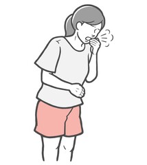 口を手で押さえて咳をする若い女性