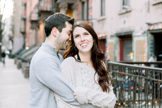 A Couple Keeping Each Other Warm In The City