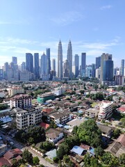 Fototapeta na wymiar Kuala Lumpur, Malaysia - July 16, 2020: View of Kuala Lumpur skyline during sunny day.