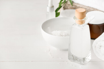 Fototapeta na wymiar Bottle of rice water on table