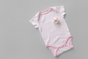 Cotton baby clothes on grey background