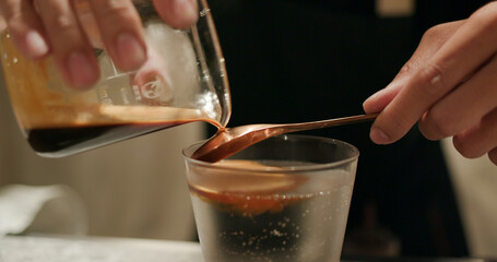 Pour espresso coffee into tonic water, mock tail beverage