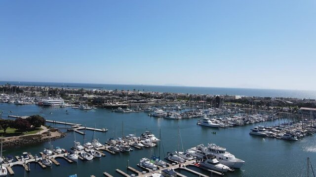 Aerial Flyover of a Busy Marina During Summer