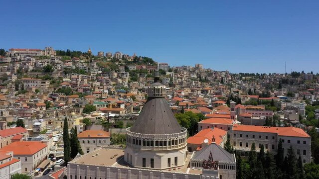 160 long shot flight showing the great Basilica of the Annunciation and the old magical city of Nazareth, Israel