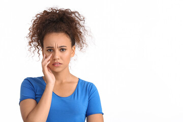 Sad African-American woman on white background. Stop racism