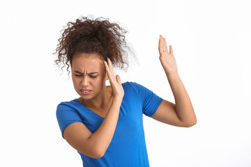 Scared African-American woman on white background. Stop racism