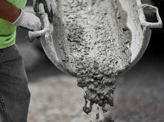 Construction Worker holding a Cement Shute