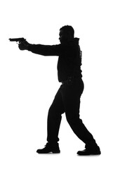 Silhouette of aggressive African-American police officer with gun on white background