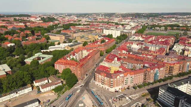Drone aerial view of Beautiful cityscape of Gothenburg Sweden. Flying above nice suburban with iconic red rooftops village in Europe. City landscape panoramic view.