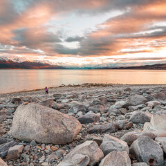 Girl on Rocky Beaching looking at Mount Cook