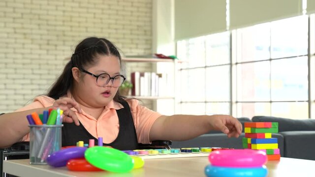 Cheerful boy with disability at rehabilitation center for kids with special needs 