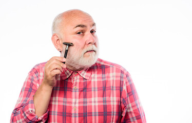 Fototapeta premium Cool and trendy. unshaven old man has moustache and beard. mature bearded man isolated on white. cut and brush hair. shaving razor blade tool kit. barbershop concept. shaving accessories. copy space