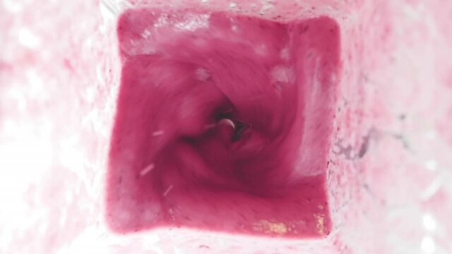 Mixing a Pink Strawberry-Currant Shake.  Healthy Juice. Breakfast. Slow Motion