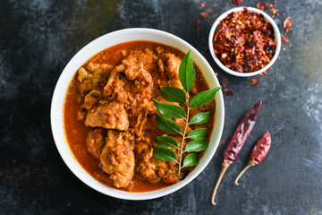 Kerala style chicken curry with gravy, a hot and spicy dish in Kerala India. Traditional Indian side dish masala chicken served with Roti, Chapati, rice, naan, Paratha or Parantha.