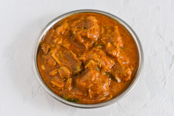 Dum Ka Murgh or Lagan Ka Murgh tikka slow cooked chicken hot and spicy curry dish Hyderabad, India. Popular South Indian non-vegetarian cuisine prepared using yogurt, tomato, Garam Masala. 