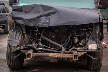 Fototapeta premium Front of black car get damaged by accident on the road.