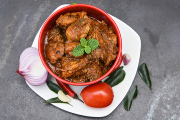 Masala chicken curry,  korma a popular North Indian food in Delhi, Mumbai India. Kerala chicken roast side dish for roti/chapathi/chapati/naan/paratha/rice. Hot and spicy with thick gravy/sauce.