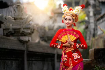 Fototapeten Bali Indonesian girl with traditional costumn dance in bali temple  © anekoho