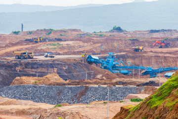 Part of a pit with big mining truck working. Coal mining at an open pit © freedom_naruk