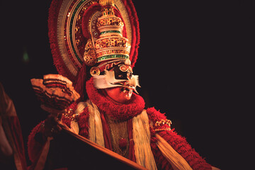 Kathakali dancer in red beard dress