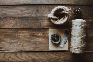 Hipster traveler hiking pack. Set for hiking in the mountains or forest. Scout concept. Rustic flat lay on a wooden table. Hipster lumberjack flat lay.