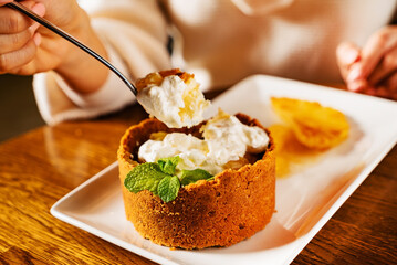 woman eating dessert with pineapple