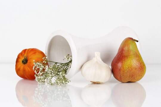 still life with pear, tomato and garlic