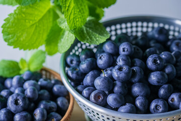 Fresh ripe blueberries in colander.