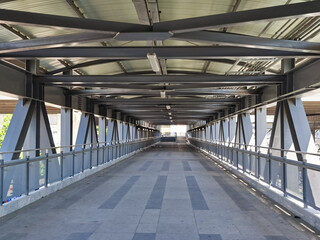 Architecture construction of elevator, escalator stairs and sky walk way, walk bridge between sky train station and department store mall