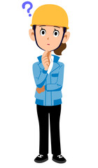 疑問を持つヘルメットを被った作業着の女性
