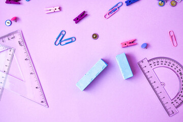 School subject books with supplies on color background, back to school. Stationery ruler pencil...