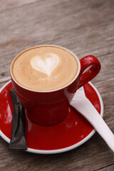 coffe latte cup on a wood table.