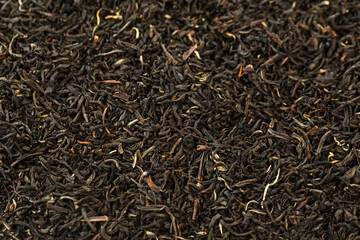 Leaves of black premium dry tea on a white background